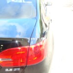 Before and after photographs of a damaged black Volkswagon Jetta that was repaired by Elite Paint & Body Shop in West Palm Beach, Florida.